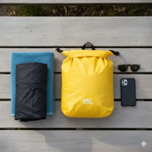 A side-by-side comparison illustrating the 15L dry bag next to common items (towel, phone, jacket) to show its ample storage capacity.