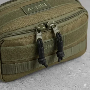 Detail shot of the two-way, heavy-duty zipper pulls on the small admin pouch, designed for quick and reliable access to contents.