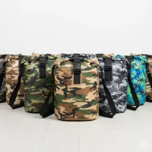 An array of dry bags displayed, showcasing various camouflage patterns and colors available, such as woodland, desert, and digital camo.