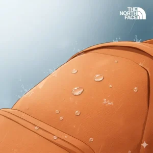 Water droplets beading off the durable fabric of an orange backpack north face.