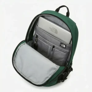 Open main compartment with a laptop sleeve inside a green the north face backpack.