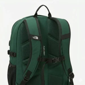 The ergonomic FlexVent shoulder straps of a green the north face backpack.