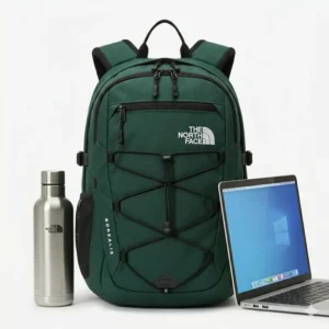 Size comparison of a green the north face backpack next to a laptop and bottle.