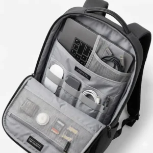 Interior view of a macbook pro backpack showing organized slots for chargers, cables, and tablets.