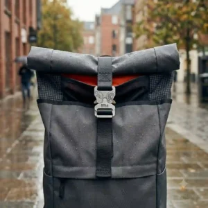 An illustration showing how the top of a roll backpack extends to increase storage capacity.