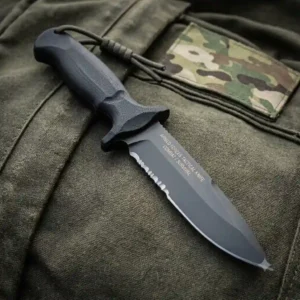 High-carbon steel blade of a fixed blade military armed force tactical knife with a non-reflective black oxide coating.